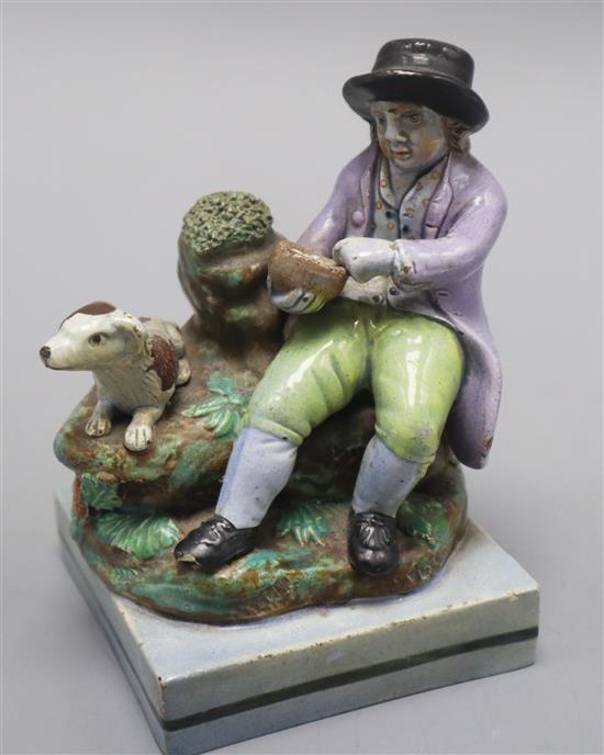 A Wood type pearlware group, c.1810 of a man with a birds nets height 13cm